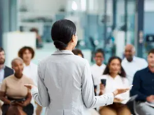 A person doing a conference.